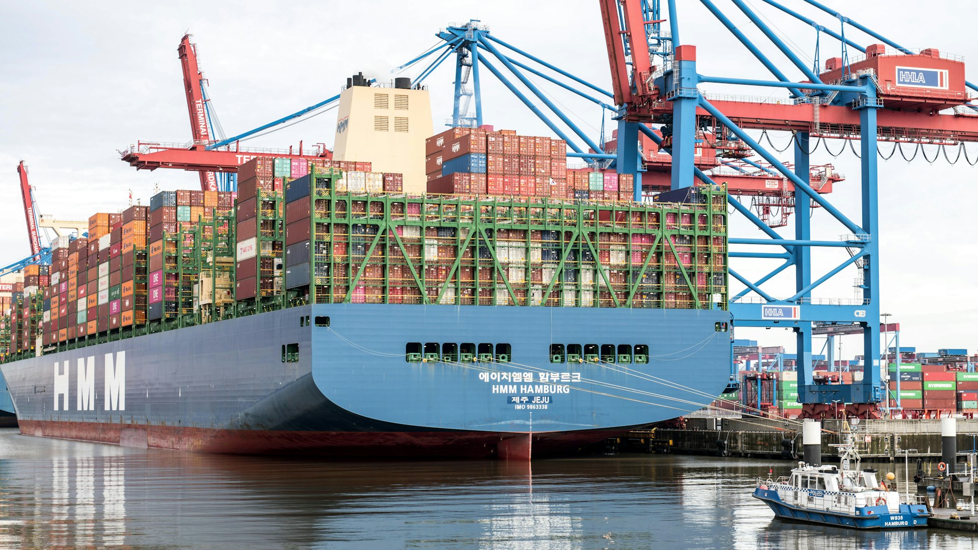 a large cargo ship is docked at a dock